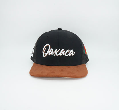 45 Oaxaca Cursive Trucker Cap Black Rust