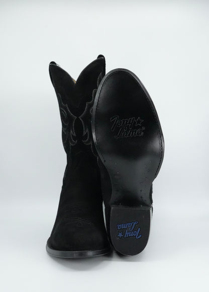 Black cowboy boots with brand logo on a white background